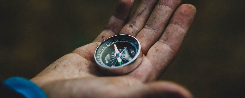 hand with compass